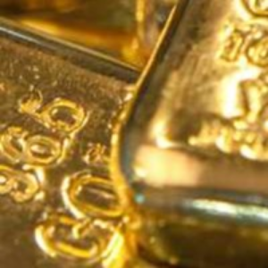 Close-up of a gold bar with '999' purity mark